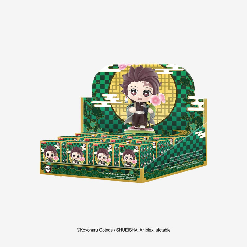 Display box with figurines featuring a character in a green and gold checkered design.