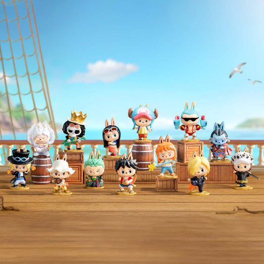 Collection of kawaii one piece blind box figurines on a ship deck with a blue sky background