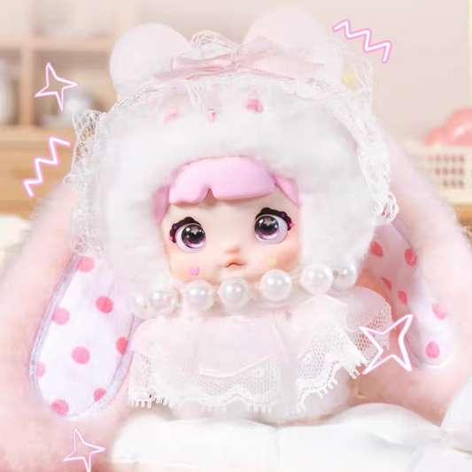 kawaii blind box plushie with white outfit and pink accents on a light background
