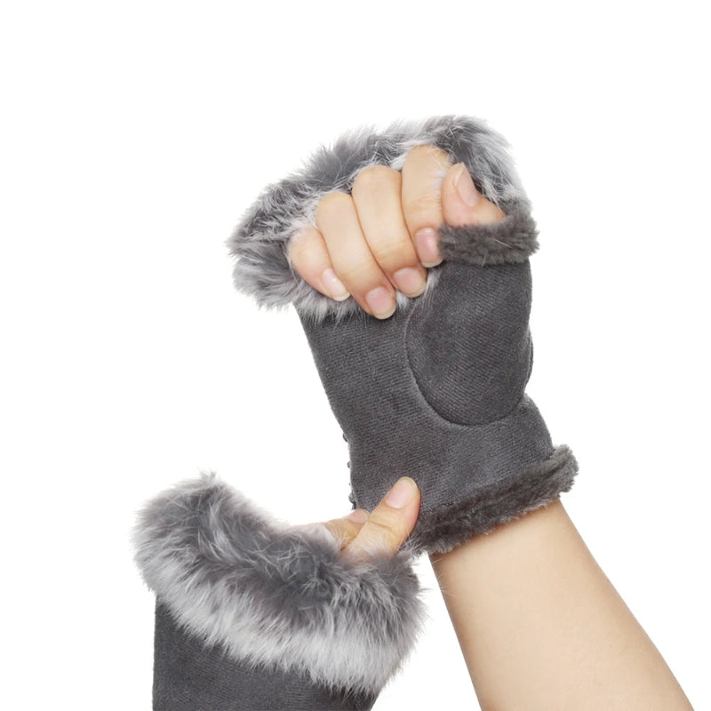 Gray fingerless gloves with fur trim worn on a white background
