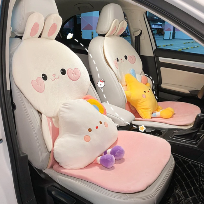 Car seat covers with cute bunny designs in a car interior