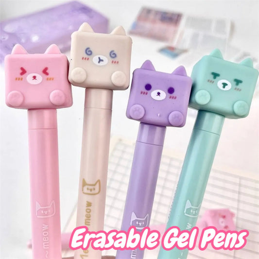 Kawaii Cat Erasable Gel Pens come in purple, pink , turquoise and cream all with different cute cats on them with different faces, this is displayed on a desk with notes in the background.