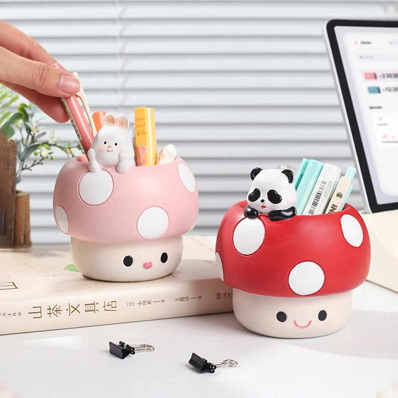 Two mushroom-shaped desk organizers with kawaii animal figures on a desk.