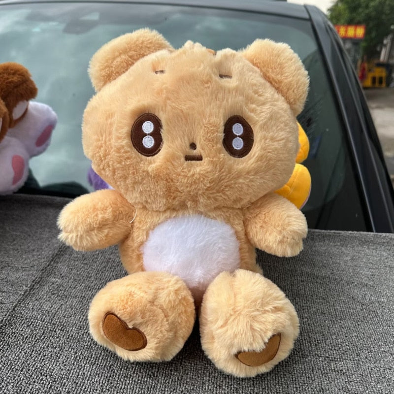 Light brown bear plushie with heart details on the feet