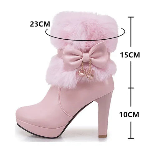 Pink high-heeled boot with fluffy bow design and measurement details on a white background
