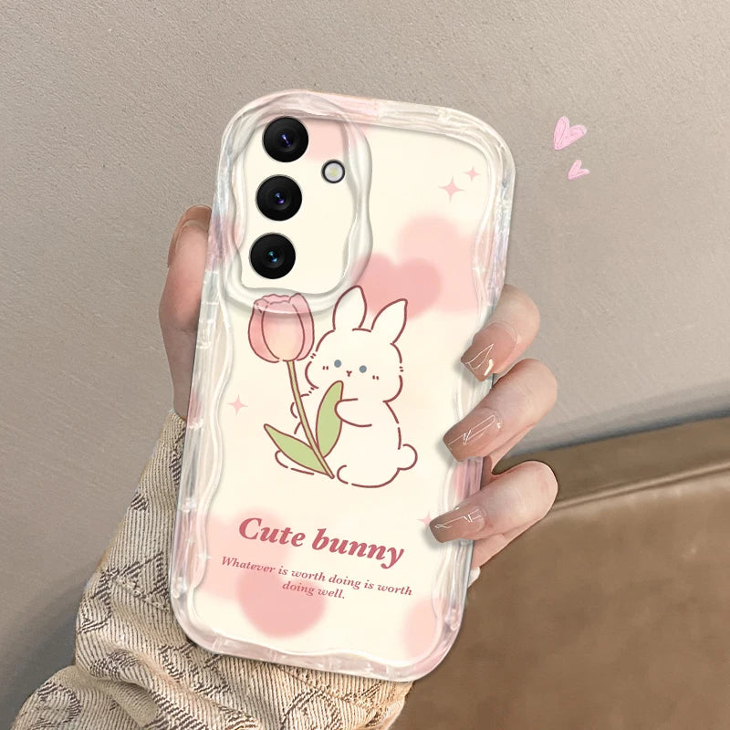 Phone case with a cute bunny design held by a person against a neutral background