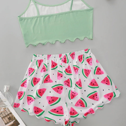 Green crop top and watermelon-patterned shorts on a gray background