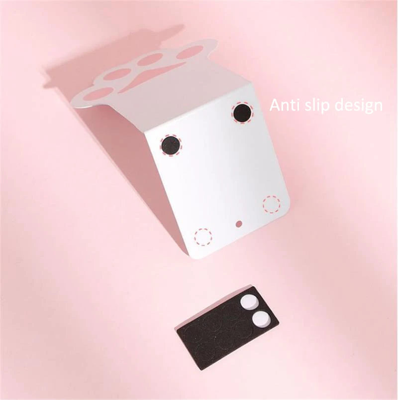 Anti-slip design on the bottom of a Kawaii Cat Paw Bookend against a pink background