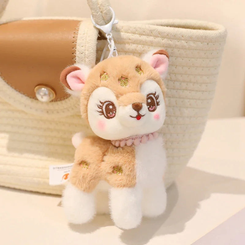 cute brown deer plushie keychain attached to a beige handbag