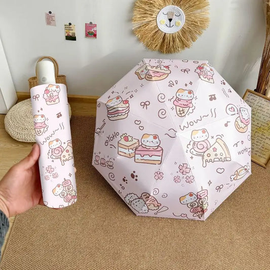 Cartoon cat -themed umbrella and case held by a hand on a wooden floor.