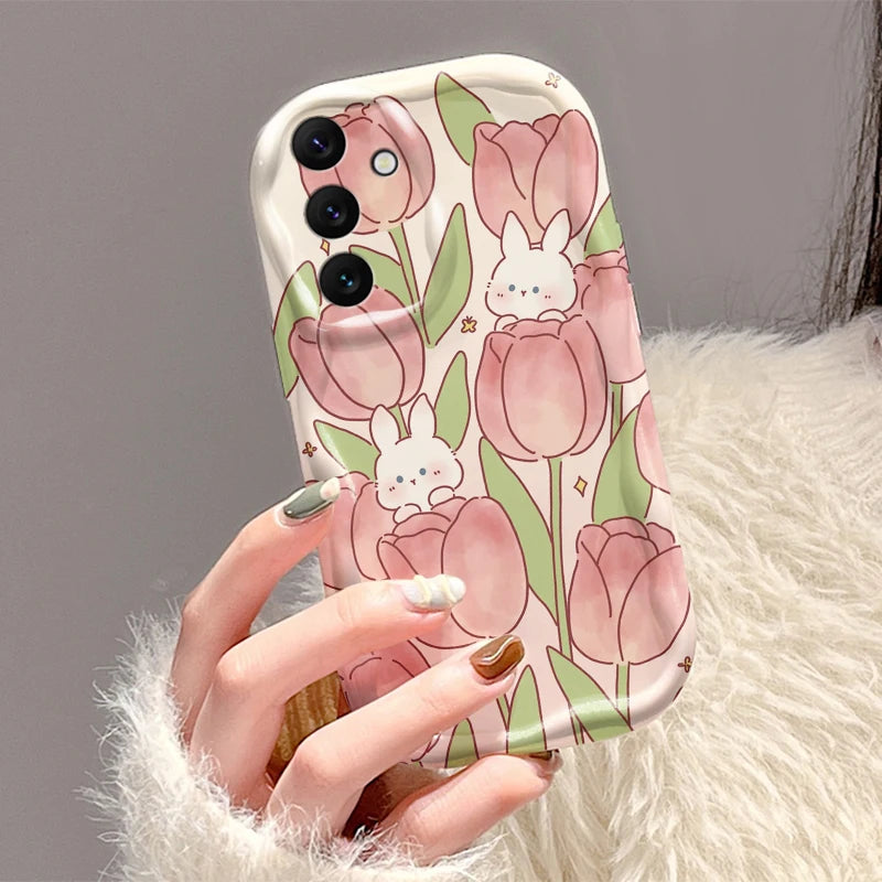 Phone case with pink tulip design and bunnies held by a person wearing a white fur coat.