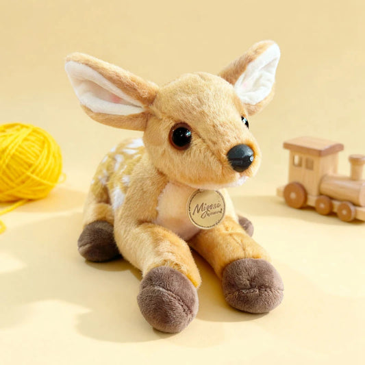 Plush deer toy with a visible brand tag on a beige background