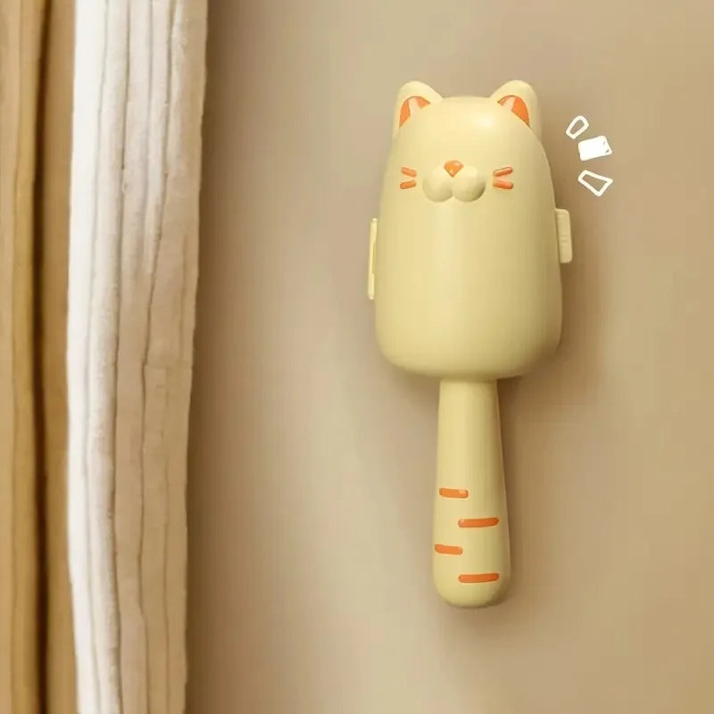 Cat-shaped lint roller on a beige background