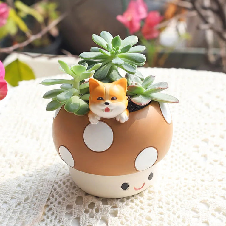 cute shiba inu figure on a kawaii mushroom shaped planter with a succulent in it.