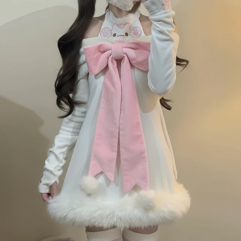 Person wearing a white outfit with a large pink bow and fluffy details
