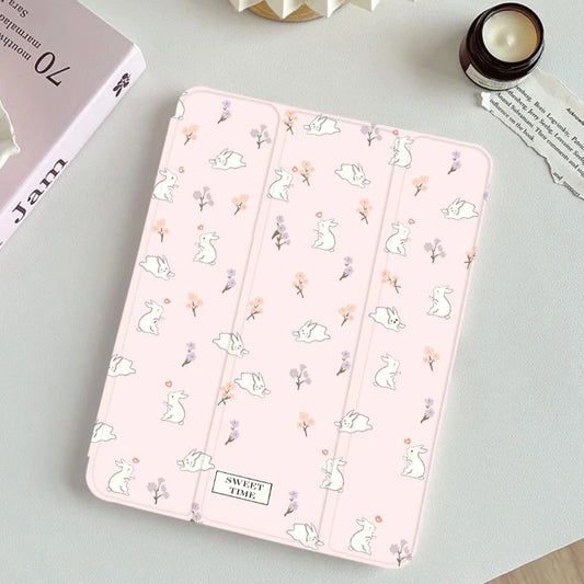 Pink tablet case with animal pattern on a light gray surface