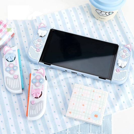 Small handheld device with cartoon character controllers on a polka dot surface