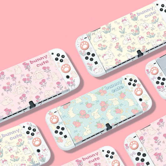 Nintendo Switch cases with cute animal patterns on a pink background