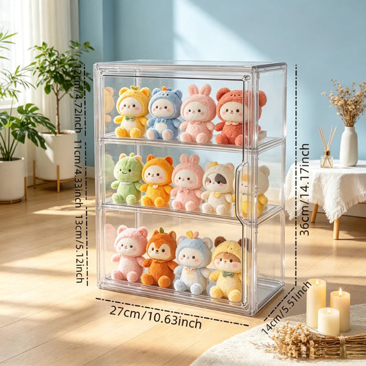 A three-tier clear plastic storage organizer filled with colorful plush toys, shown in a bright room with dimension labels overlaid on the sides and bottom.