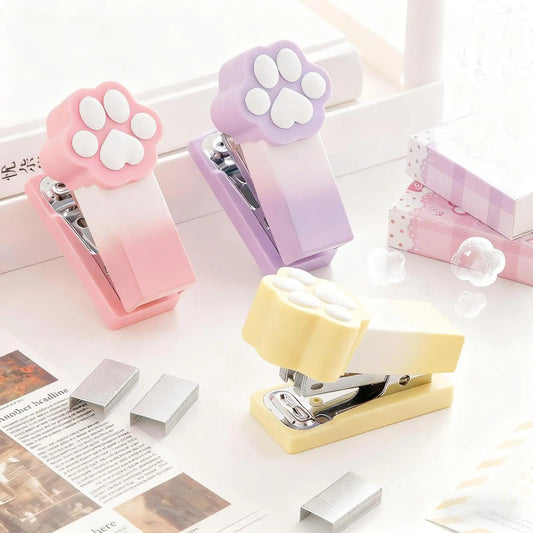 Kawaii Pastel Cat Paw Stapler, this image is showing the different colors you can get of the cat paw stapler which include pink, purple and yellow.