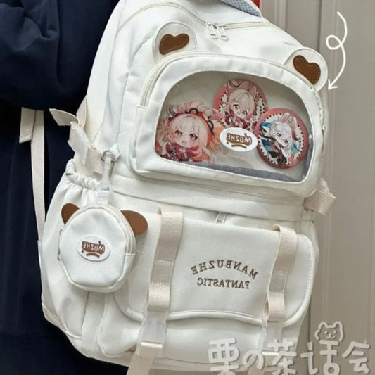 beary cute backpack with bear ears and a visible brand logo on a textured surface , white version