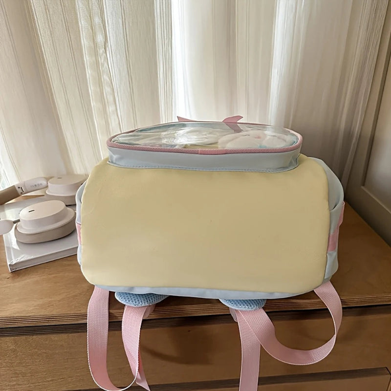 Pastel Yellow bottom view of the kawaii backpack on a wooden surface.