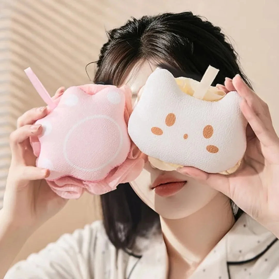 Person holding two  kawaii bath sponges.