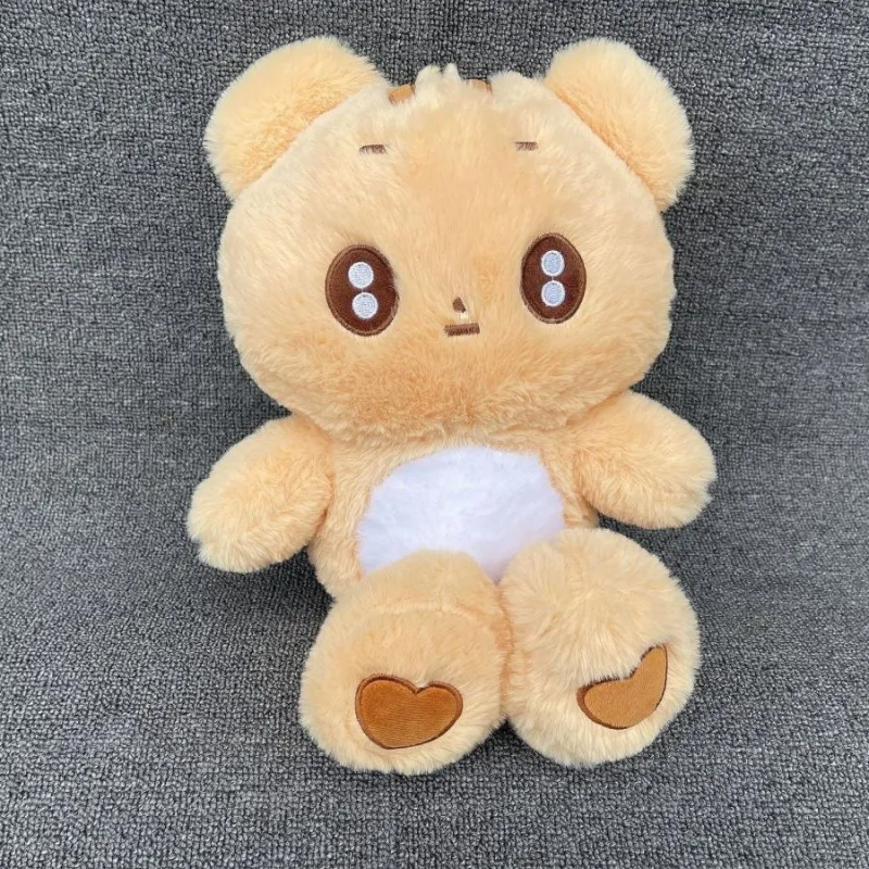 Plush toy bear with a white belly on a gray background