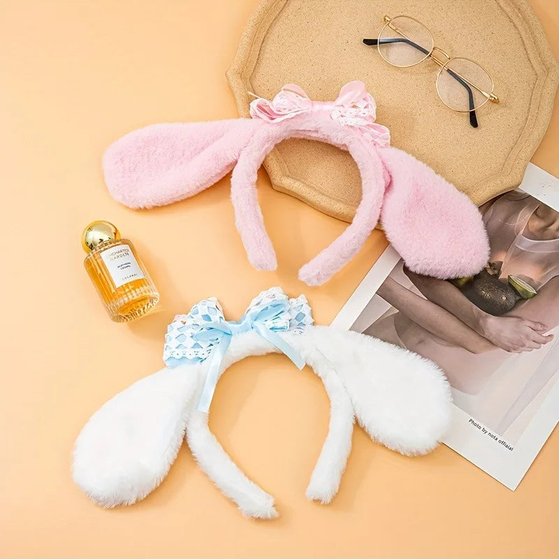 Kawaii Bunny Ears Headbands, being displayed flat on a table, the pink edition and the white and blue edition.