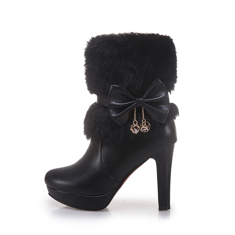 Black high-heeled boot with fur and bow detail on a white background