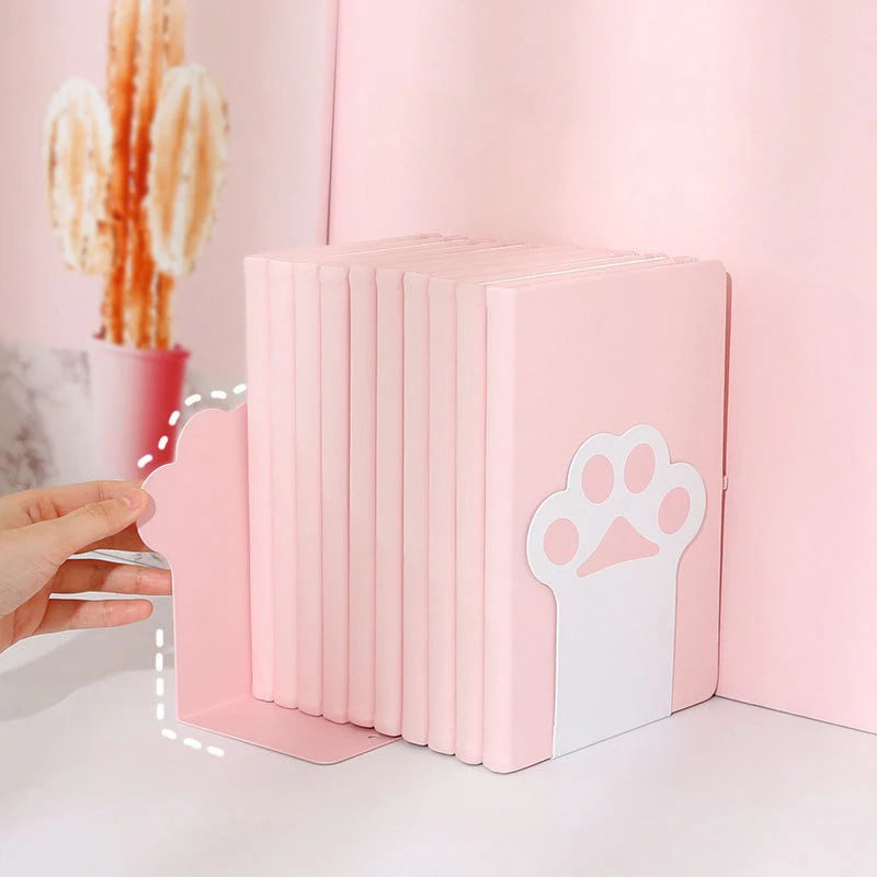 Set of pink kawaii cat paw bookends with on a light pink background