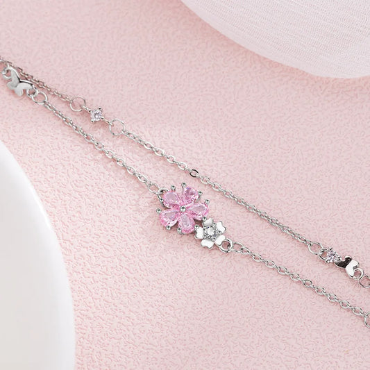 Sakura Cherry Blossom Bracelet displayed on a pink background