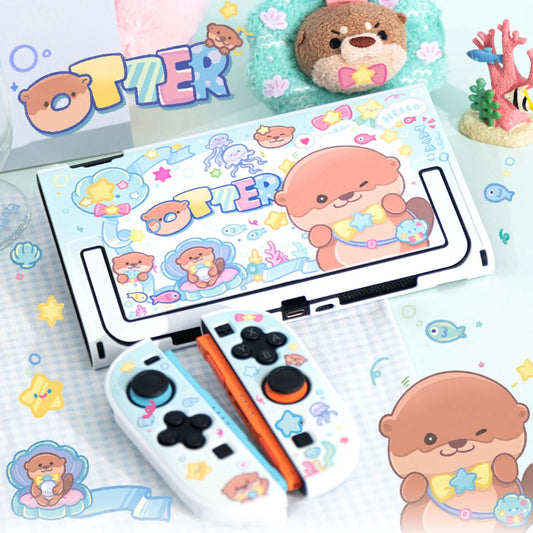 Colorful electronic device with cartoon characters and 'OTTER' branding on a decorative surface.