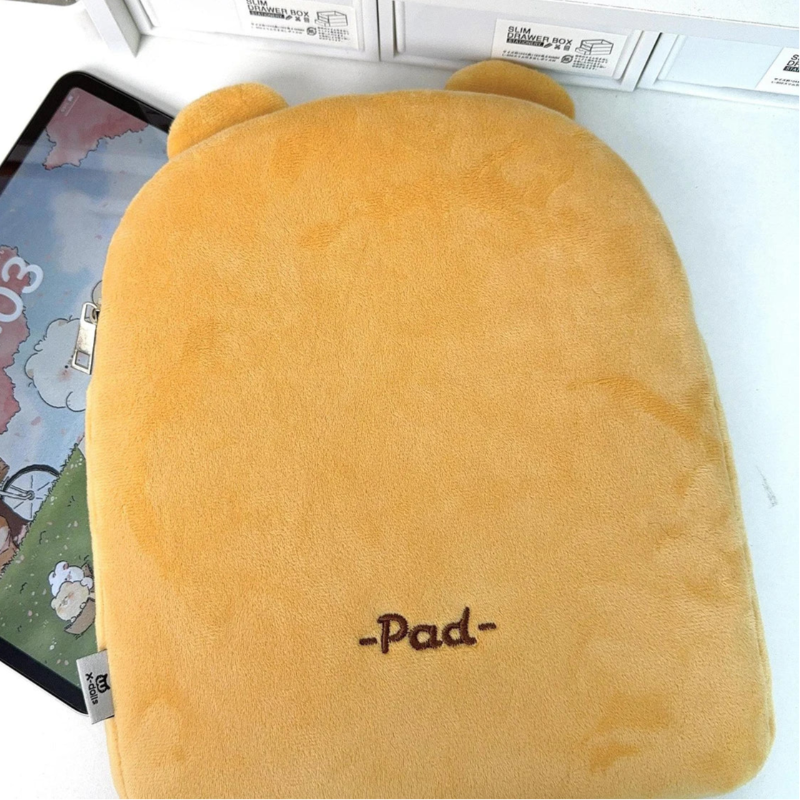 Yellow plush cover with 'Pad' embroidery on a tablet