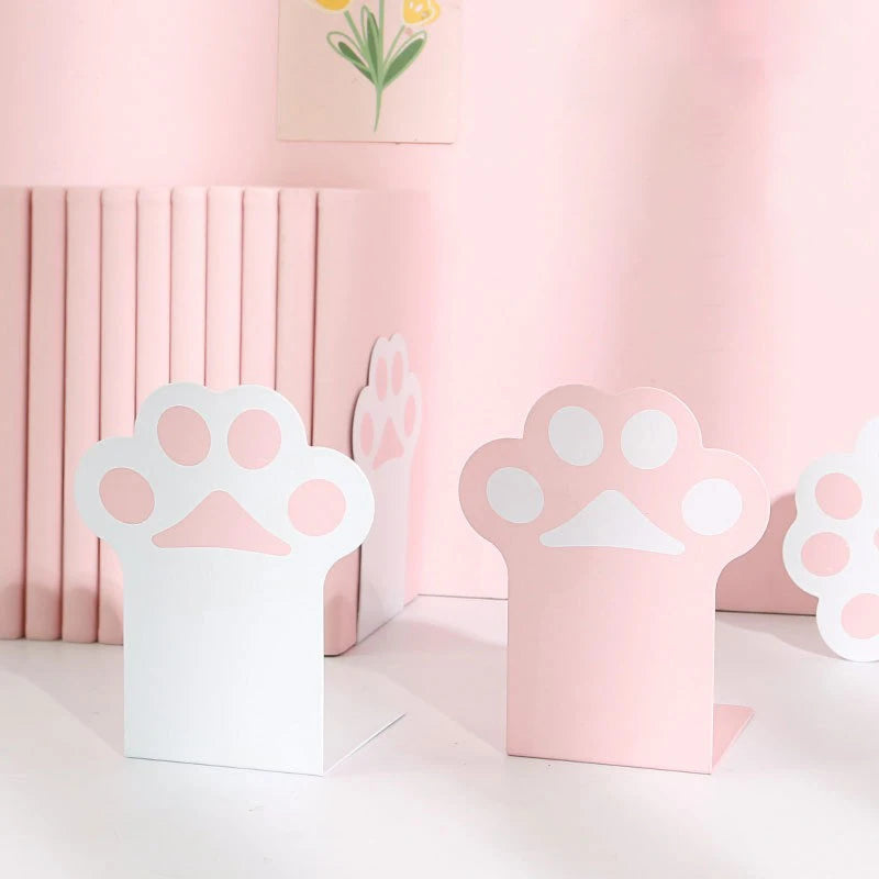 Pink and white kawaii paw print bookends on a light pink background