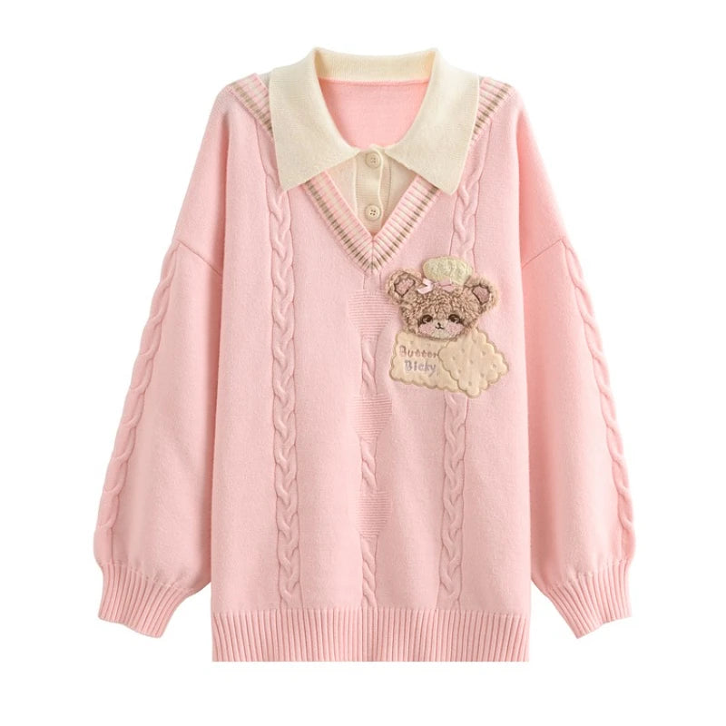 Pink sweater with a teddy bear on a white background