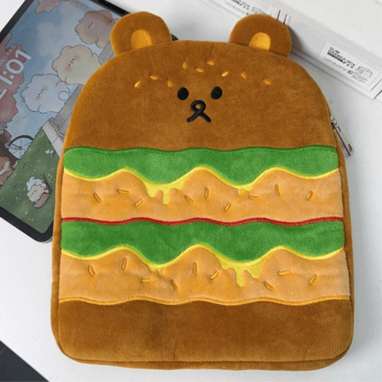 tablet sleeve designed like a bear with a hamburger design on a white surface.