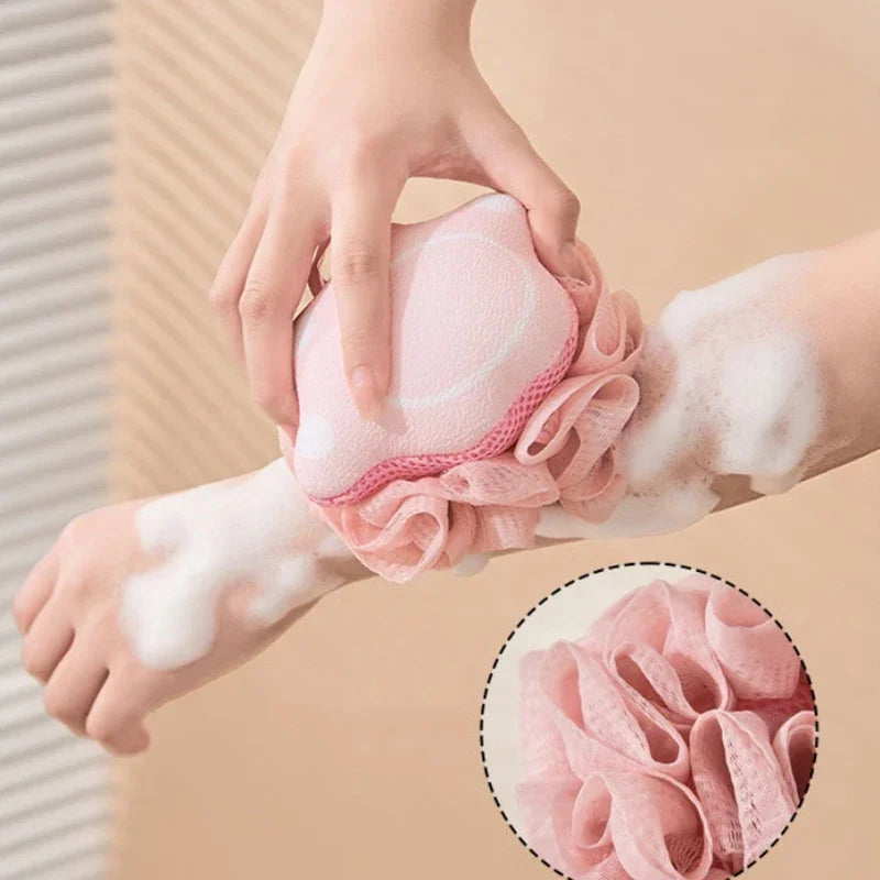 Person using a pink bath pouf with a close-up of the product on a beige background