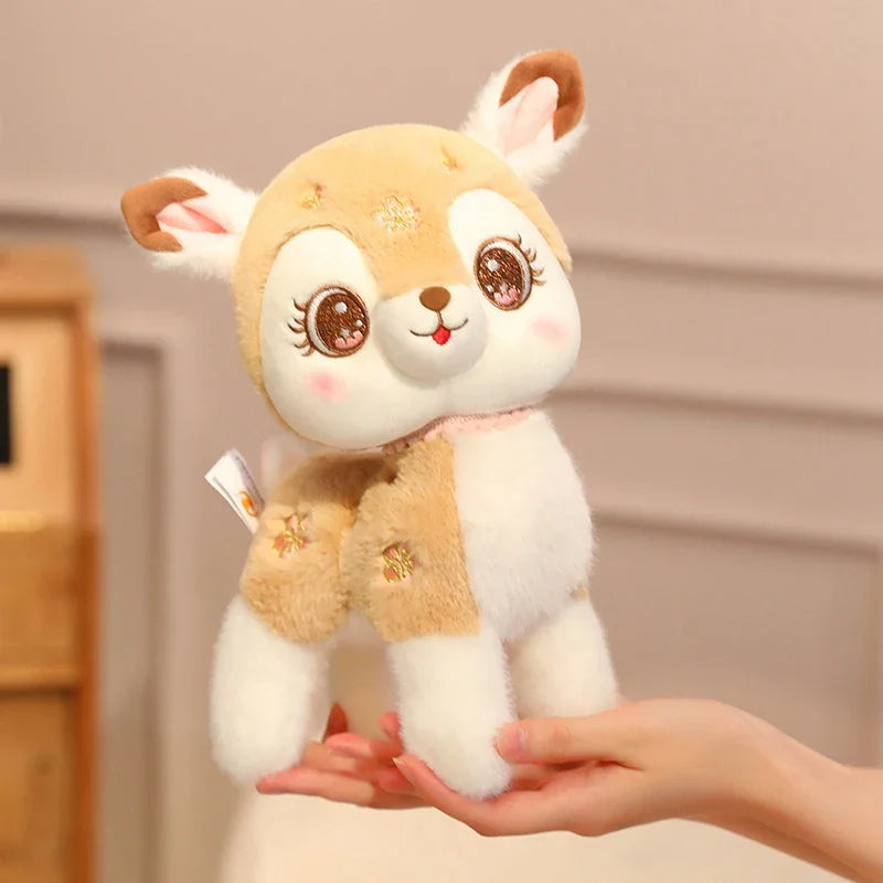Kawaii plush toy deer held in a hand against a neutral background