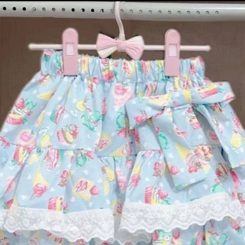 Pastel patterned blue skirt with pink clips on a hanger
