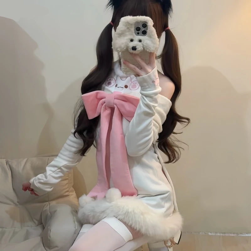 Person wearing a white outfit with a pink bow, holding a fluffy phone case.