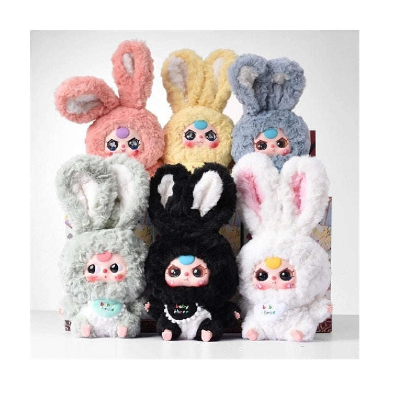 Colorful blind box plush toys with bunny ears on a white background