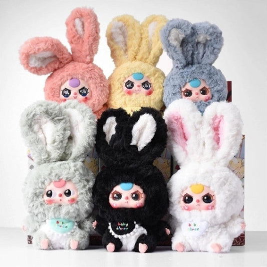 Colorful blind box plush toys with bunny ears on a white background