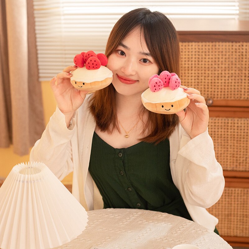 Model Holding Kawaii Strawberry Cake Plushies