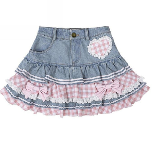 Denim skirt with pink gingham and bow details on a white background