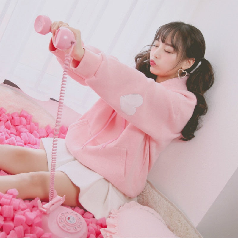 Model Wearing Kawaii Pink Heart Sleeve Hoodie Pullover