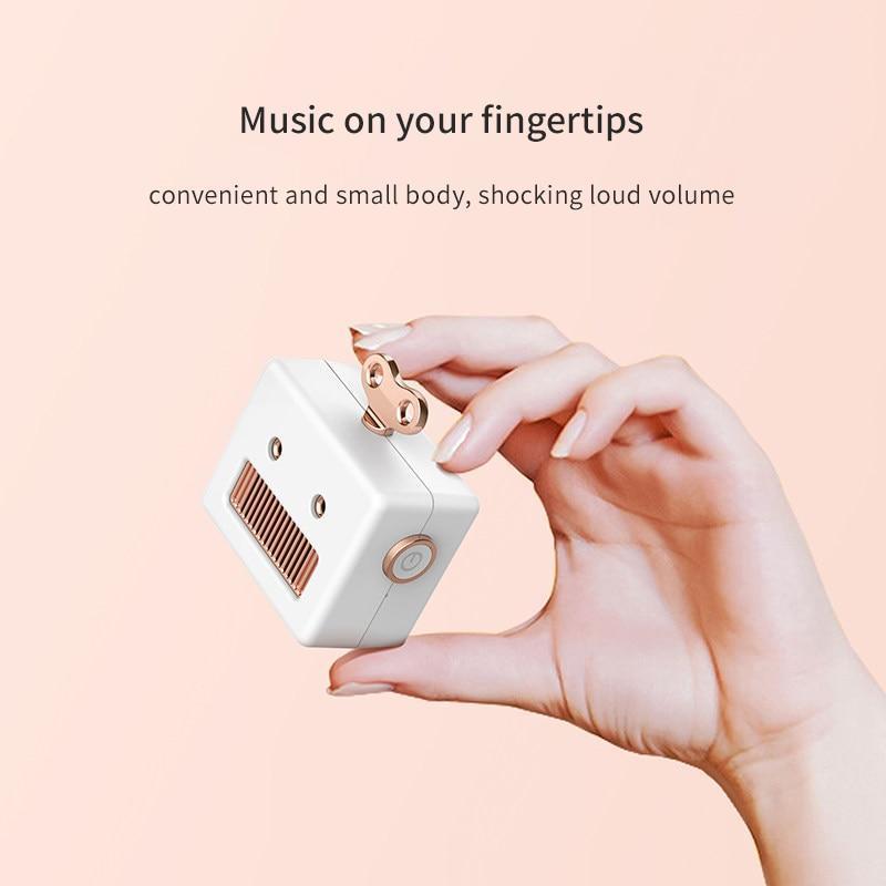 Hand Holding Our Kawaii White Robot Head Bluetooth Speaker