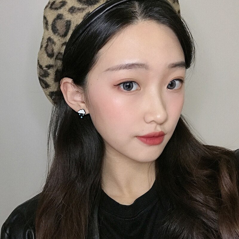 Girl Wearing Kawaii Cloud With Raindrops Earrings