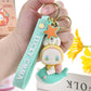 Lucky Emma Baby Keychain, this is one of the many options you can get, displayed by a person holding the keychain.