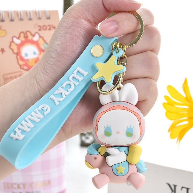 Lucky Emma Baby Keychain, this is one of the many options you can get, displayed by a person holding the keychain